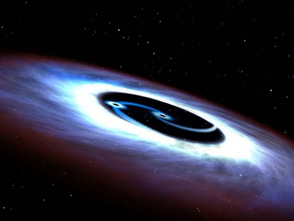 Ilustrao mostra o duplo buraco negro observado no centro do quasar mais prximo da Terra, o Markarian 231.