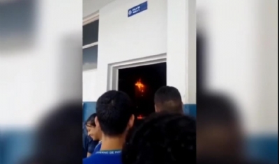 Aparelho de ar-condicionado pega fogo em colgio de Cuiab e alunos registram vdeos